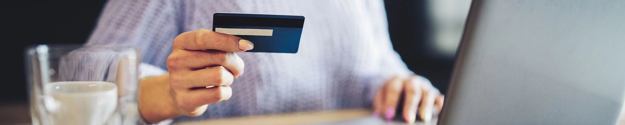 woman holding credit card